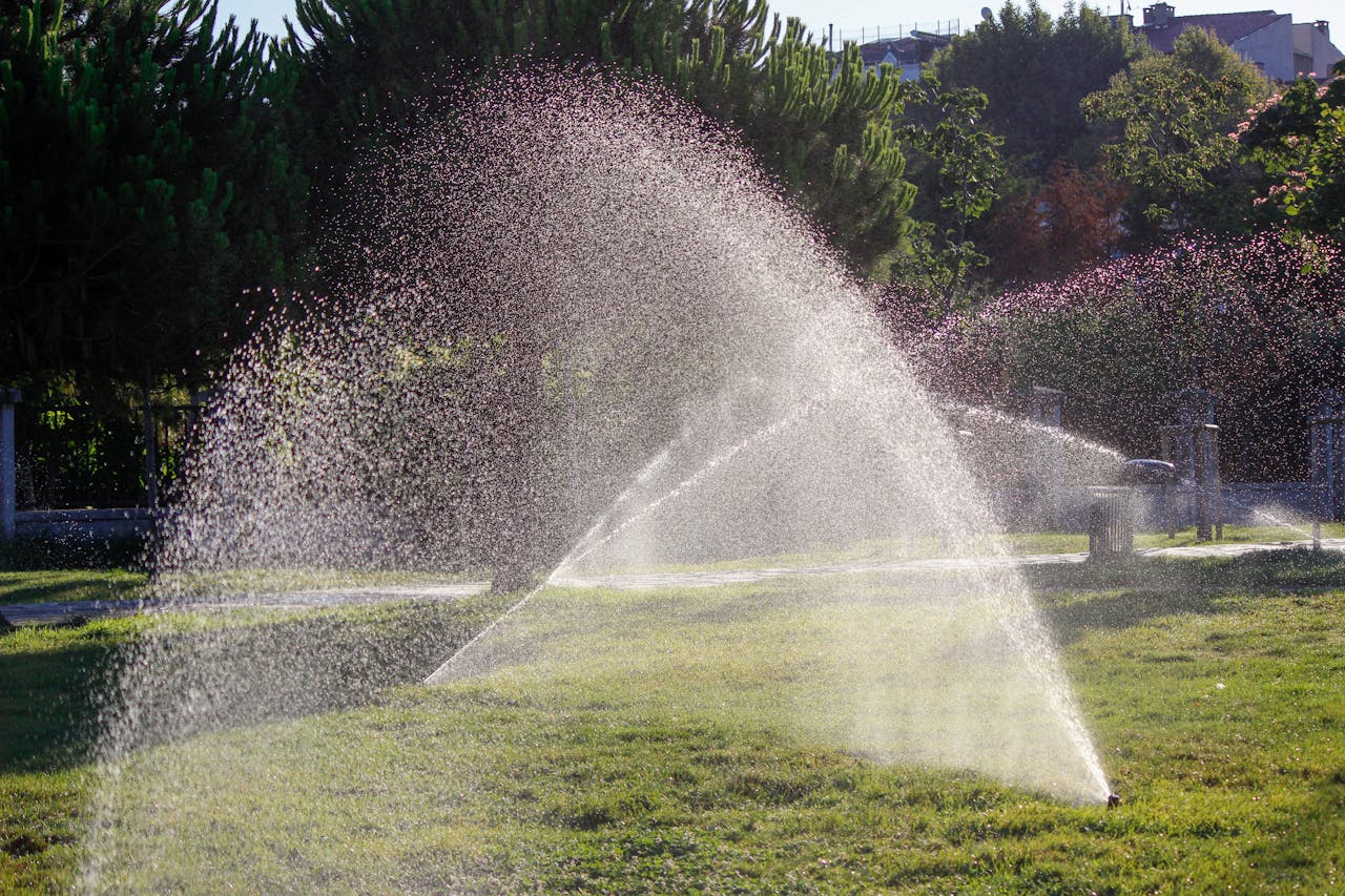 Water Sprinklers on Green Grass